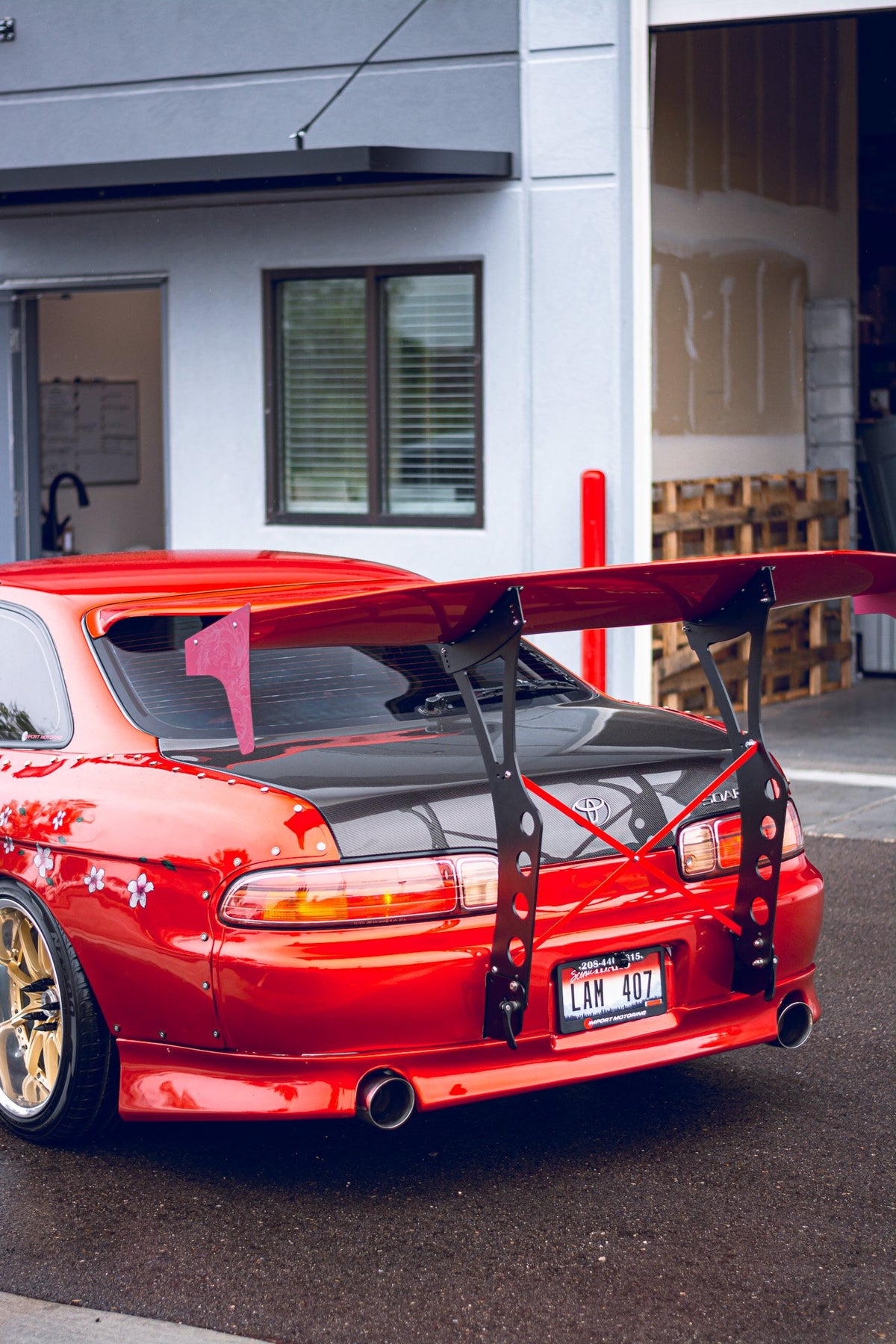 red toyota with large wing